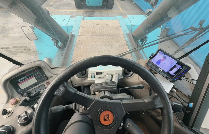 Industrial Vehicle Safety & Collision Avoidance System providing driver's POV and blind spot monitoring in a port machinery cabin.